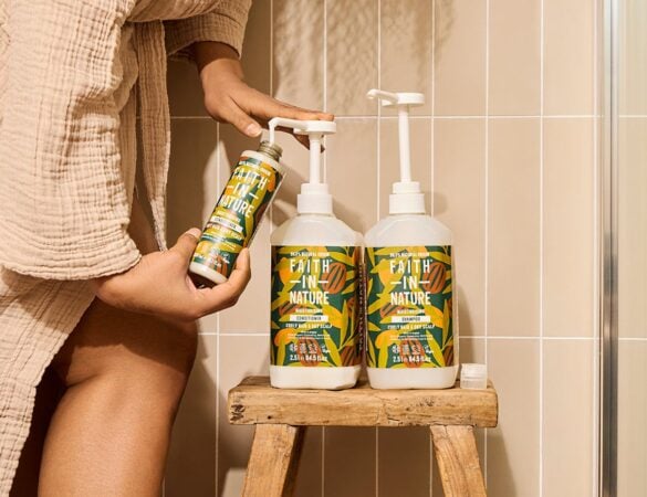 Faith In Nature curly haircare refill bottles in a natural bathroom setting