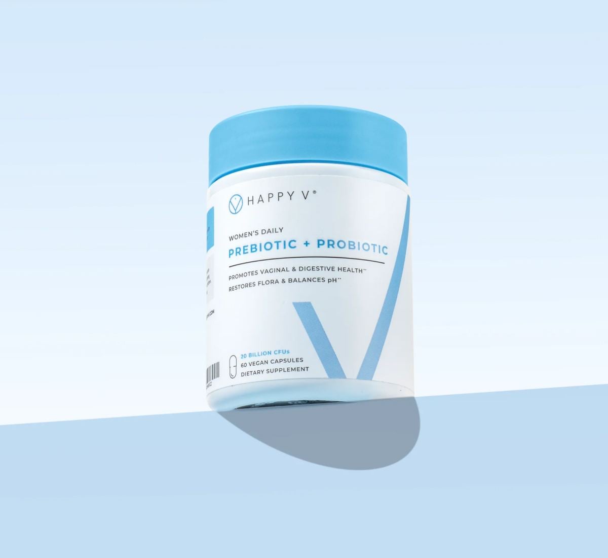 Happy V Prebiotic + Probiotic bottle on a colored background