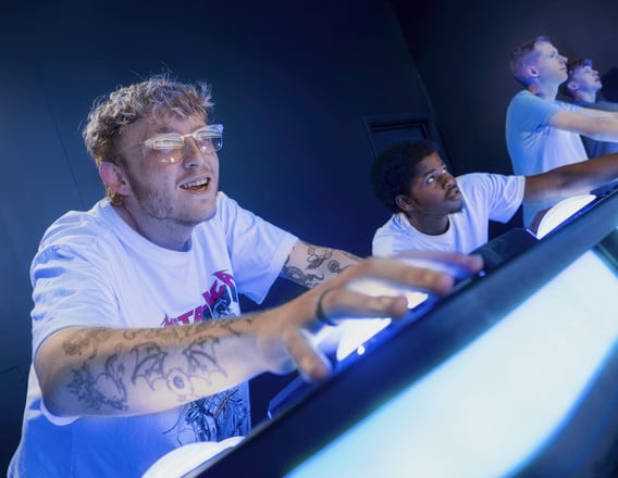 Friends playing a glowing challenge at Activate