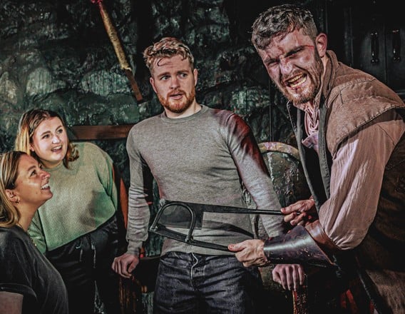 Visitors meeting an actor at The London Dungeon
