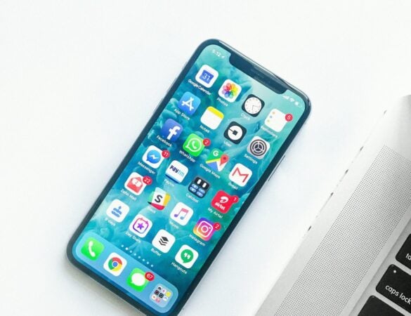Smartphone resting on a white desk