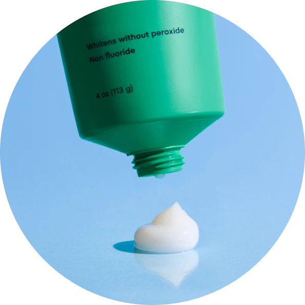 Cocoshine toothpaste displayed on a styled background