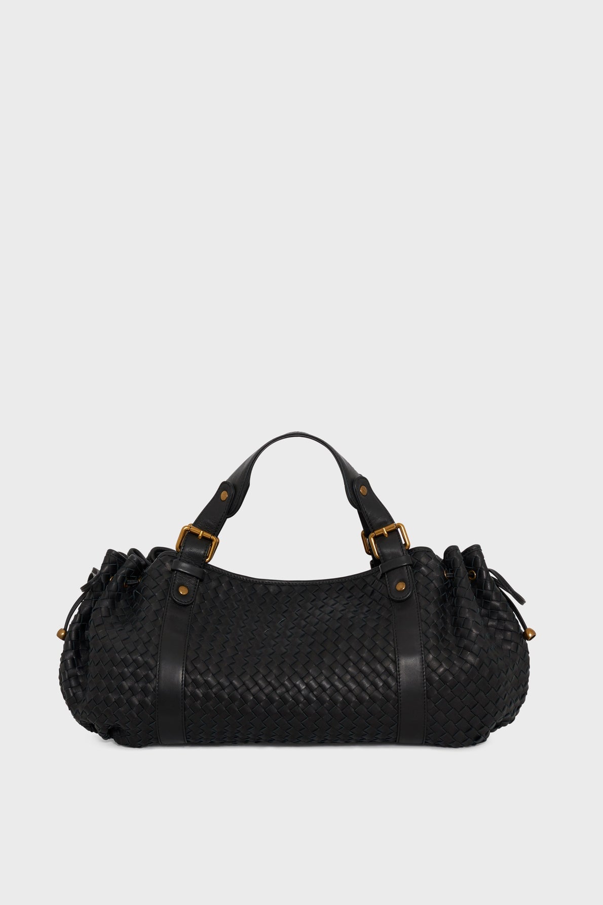 Sac 24H en cuir tressé Gerard Darel sur fond clair