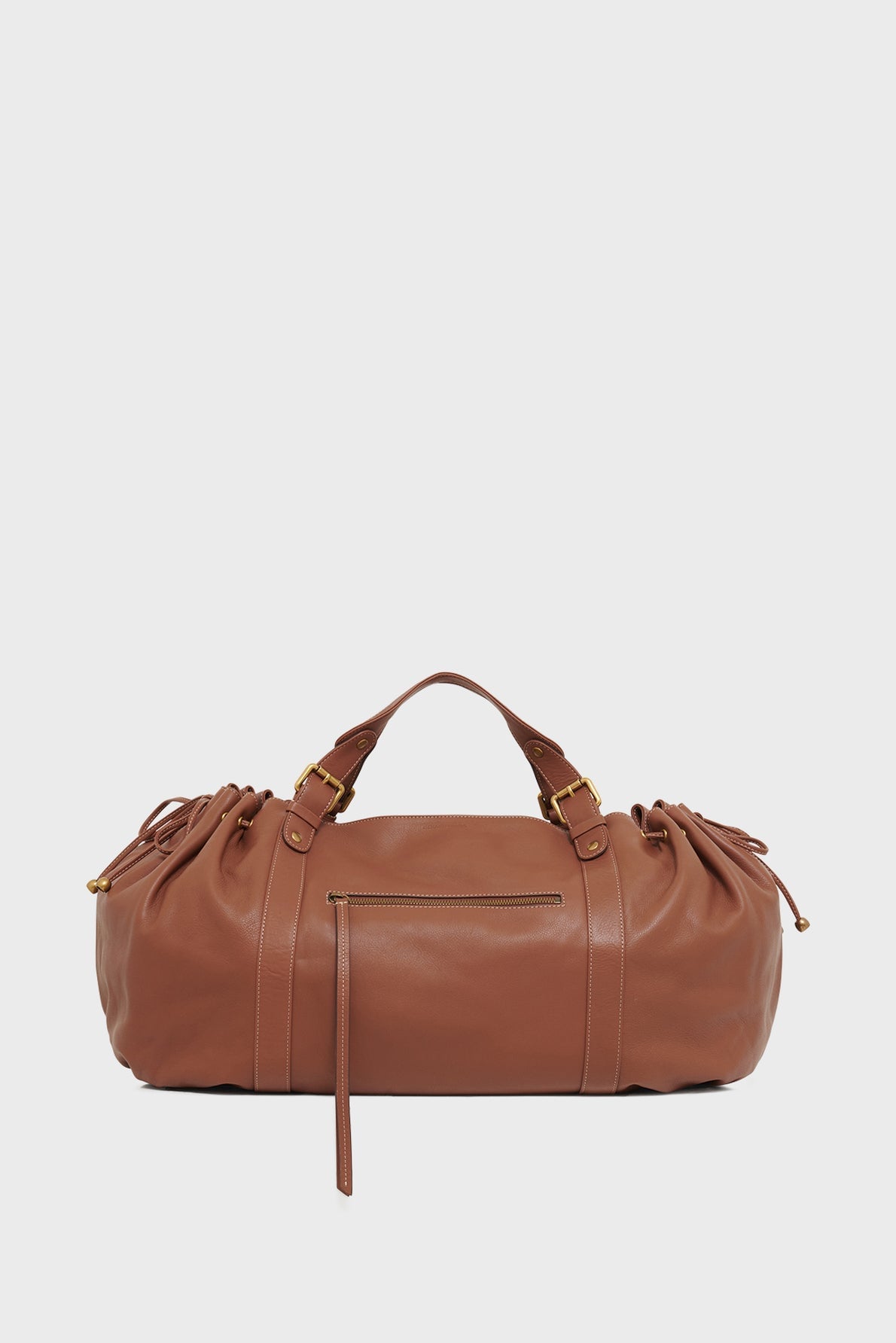 Sac de voyage 72H Gerard Darel en cuir tan photographié seul