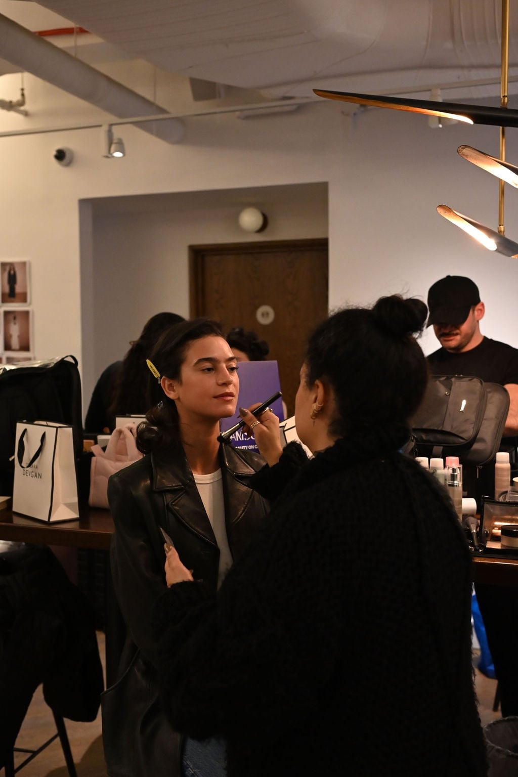 Makeup artist working backstage at an event