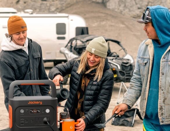 Campers using a Jackery power station in an RV setting