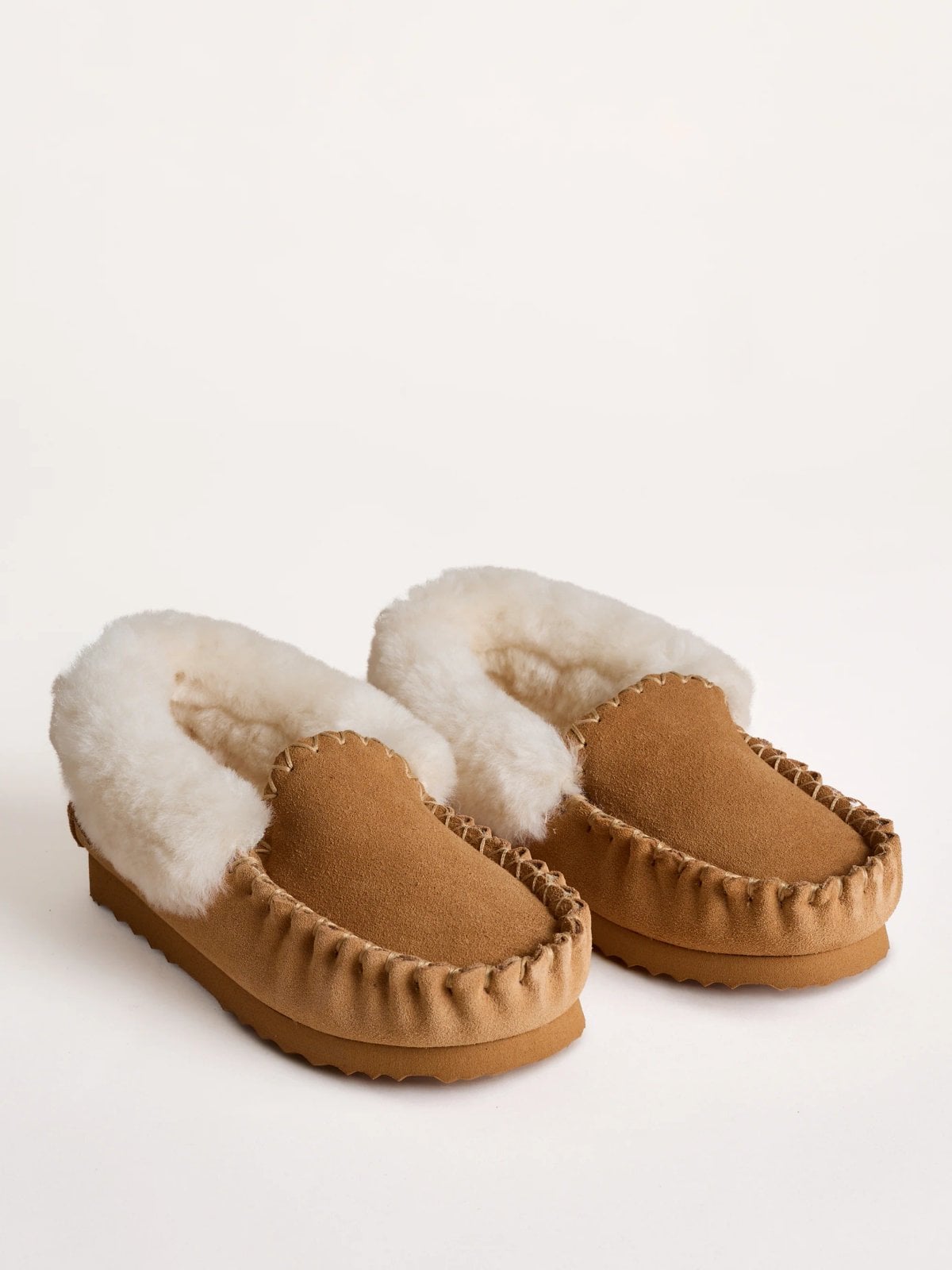 Tan sheepskin stitch moccasins