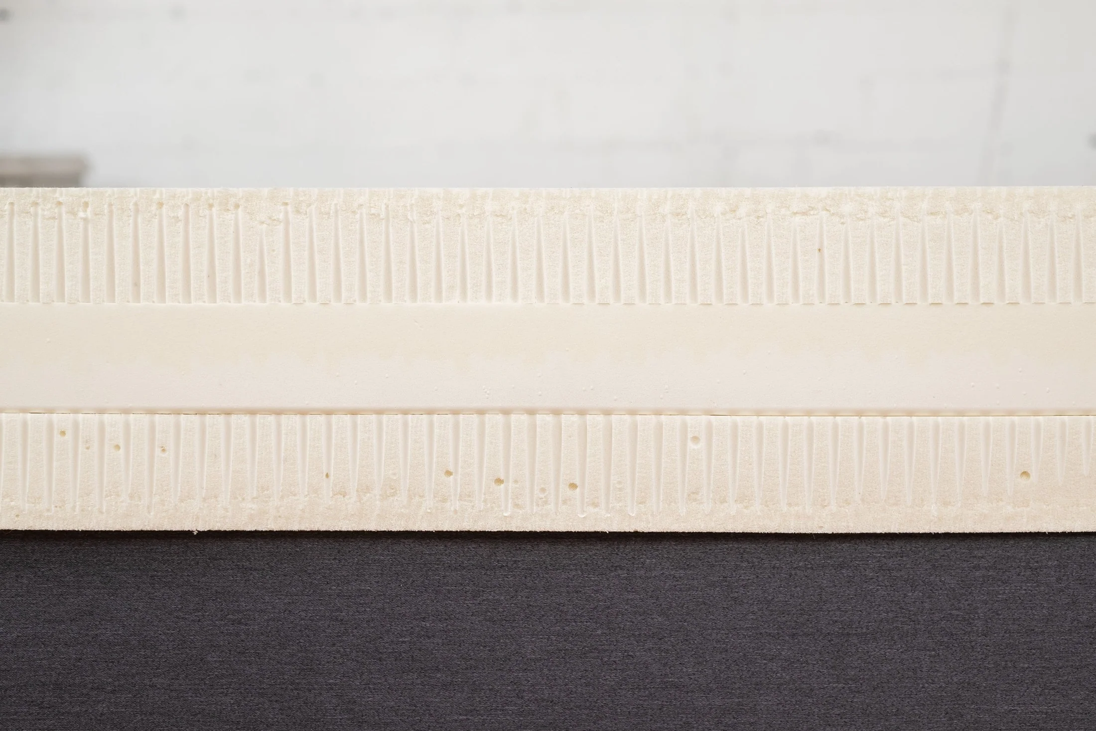 Cross section showing layers of latex mattress foam