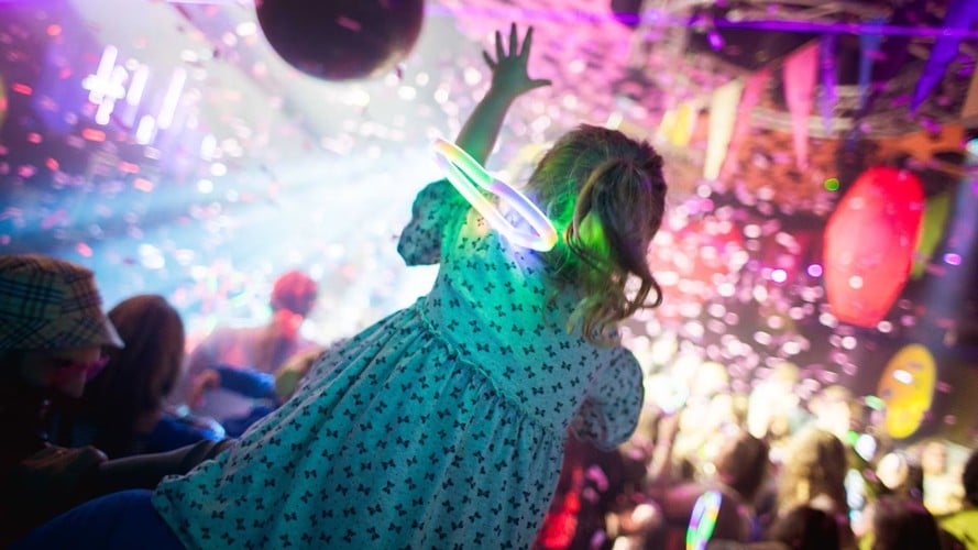 Child reaching at a concert
