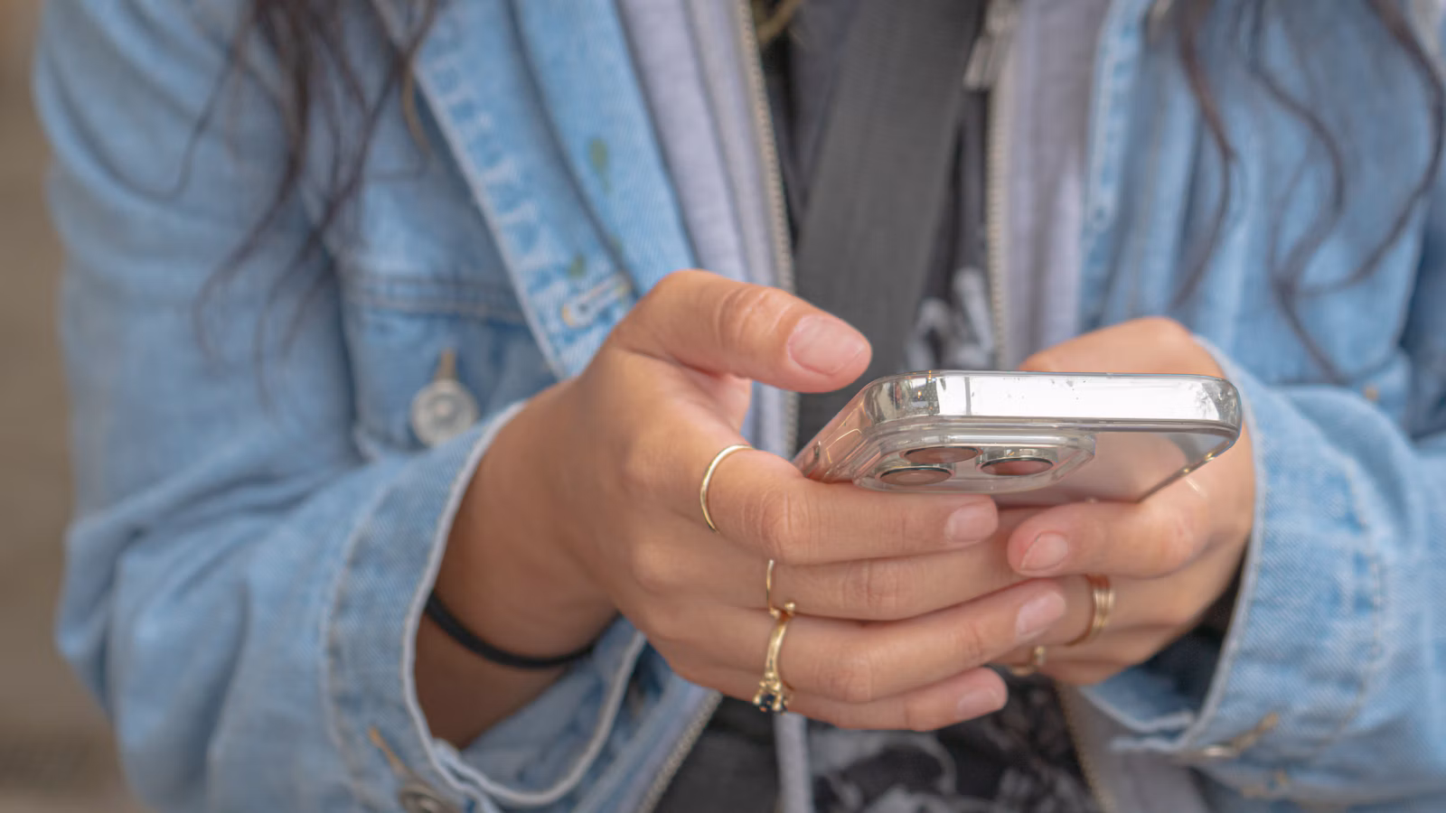 A smartphone handset photographed against a simple background