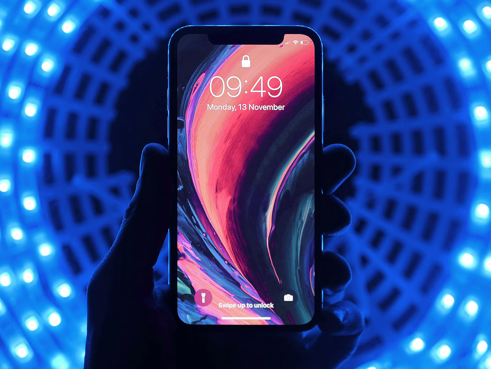 A smartphone displayed in a mobile technology setup