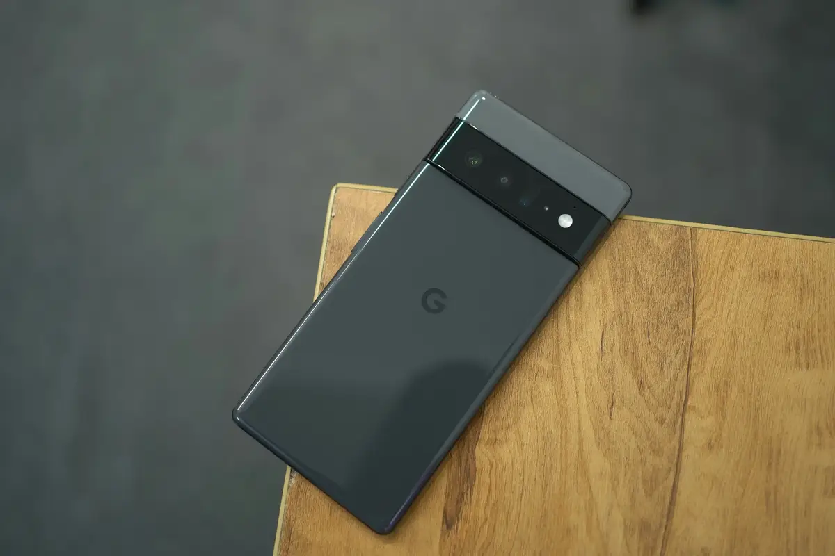 Google Pixel smartphone resting on a wooden table