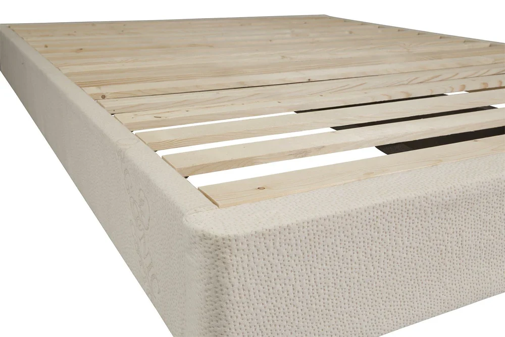 Corner detail of natural wood mattress foundation