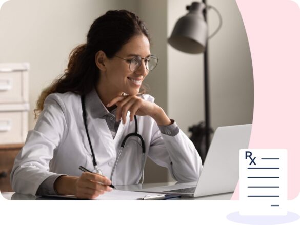 Female clinician working at a laptop