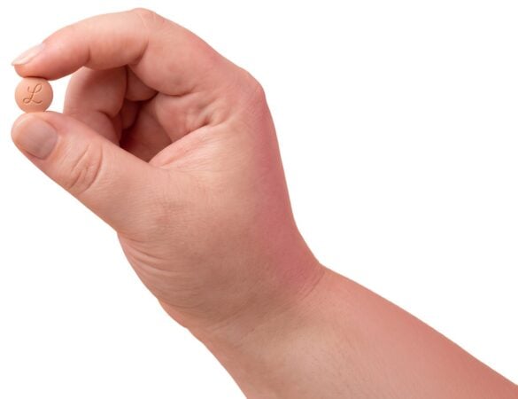 Hand holding a Foundayo tablet