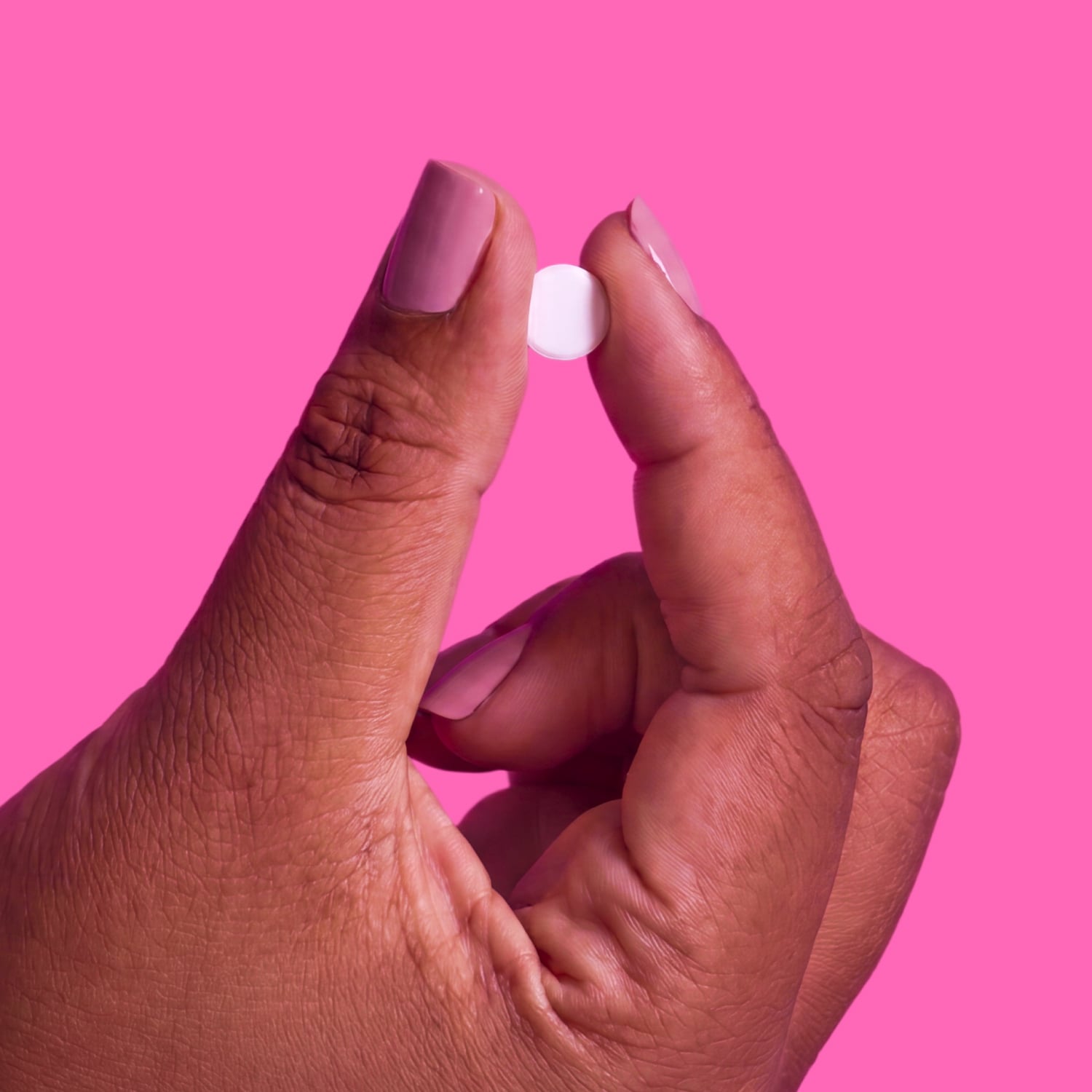 Hand holding a weight management tablet