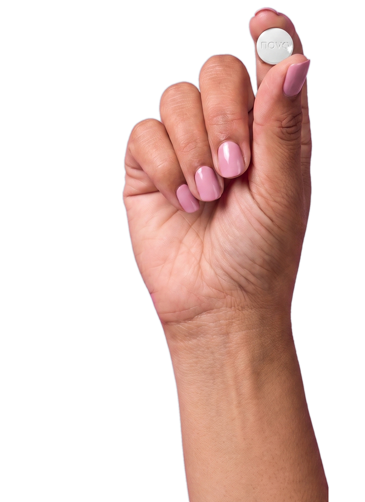 Hand holding an oral tablet