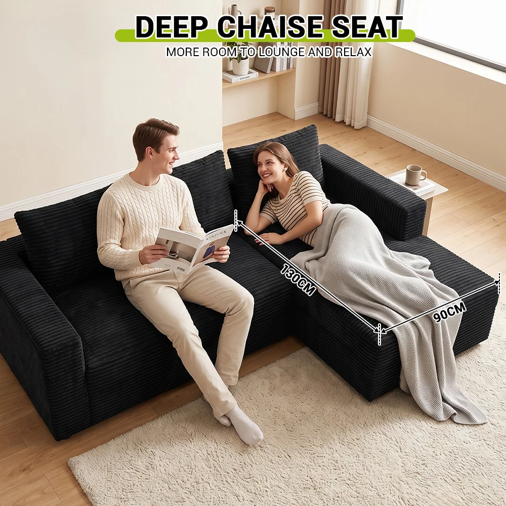Couple seated on the L-shaped sectional with its chaise visible