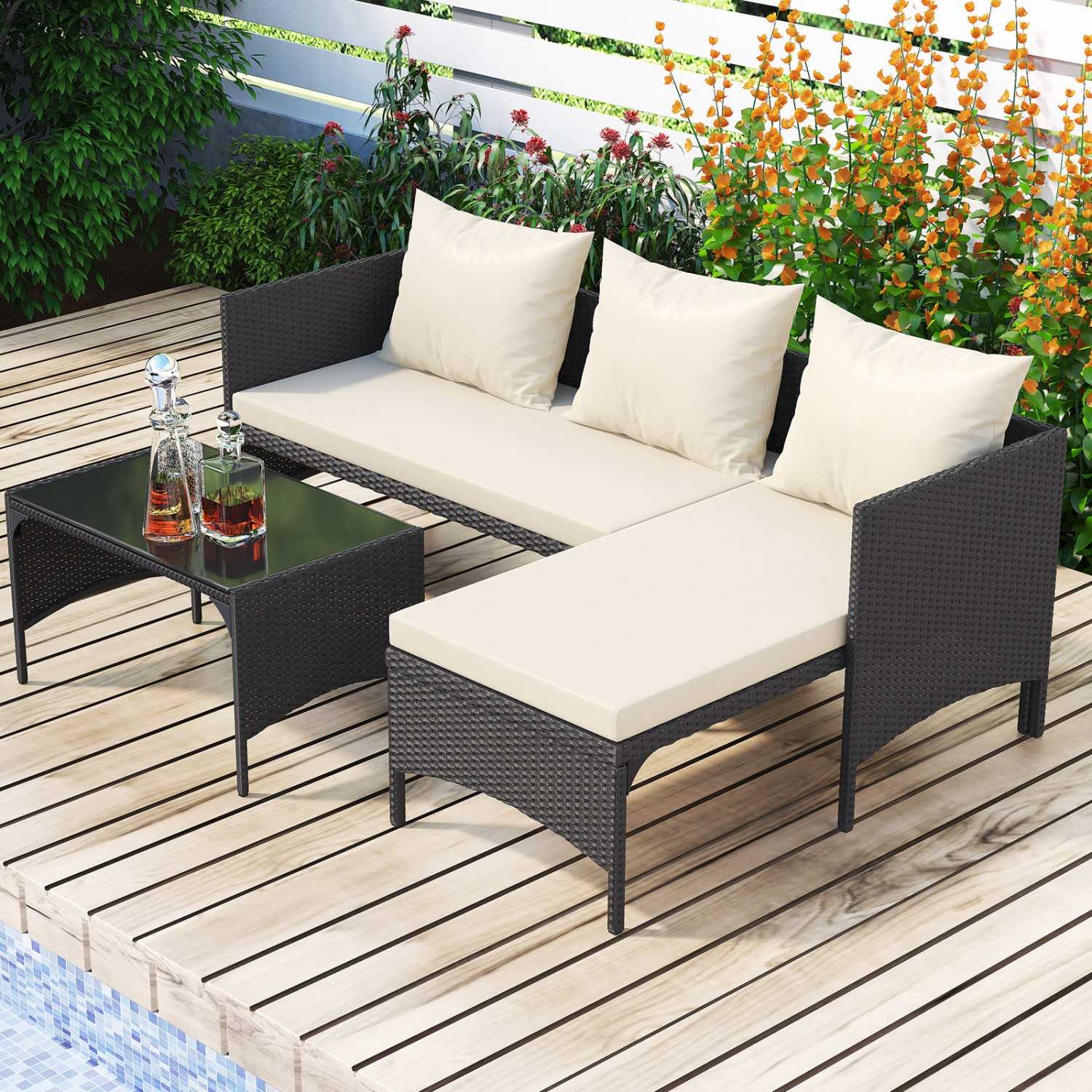 Compact three-piece rattan conversation set with a glass coffee table