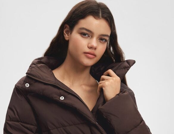 Model wearing a brown ShopAthluna Affiliate cropped puffer jacket