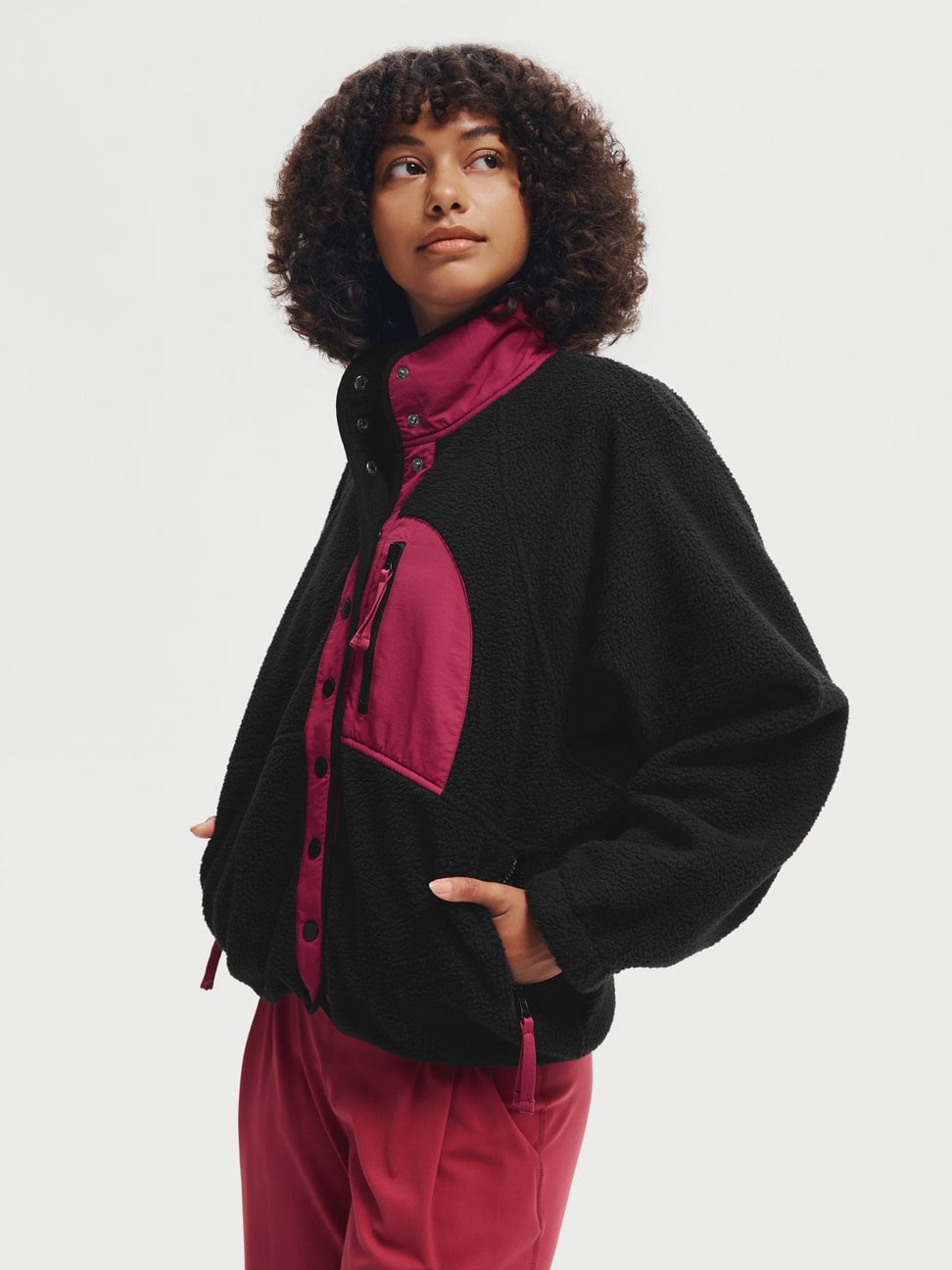 Model wearing the Fleece Button Jacket with dark rose contrast details