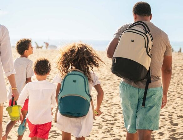 Family carrying WAYB backpacks outdoors