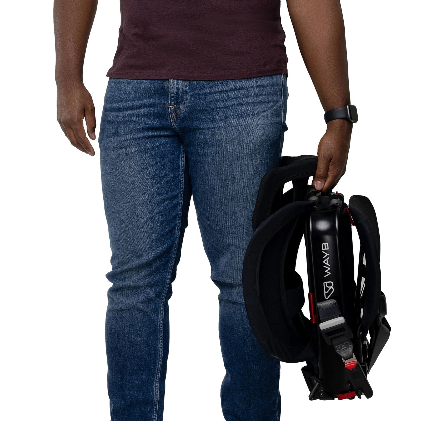 Parent carrying a folded WAYB Pico portable car seat